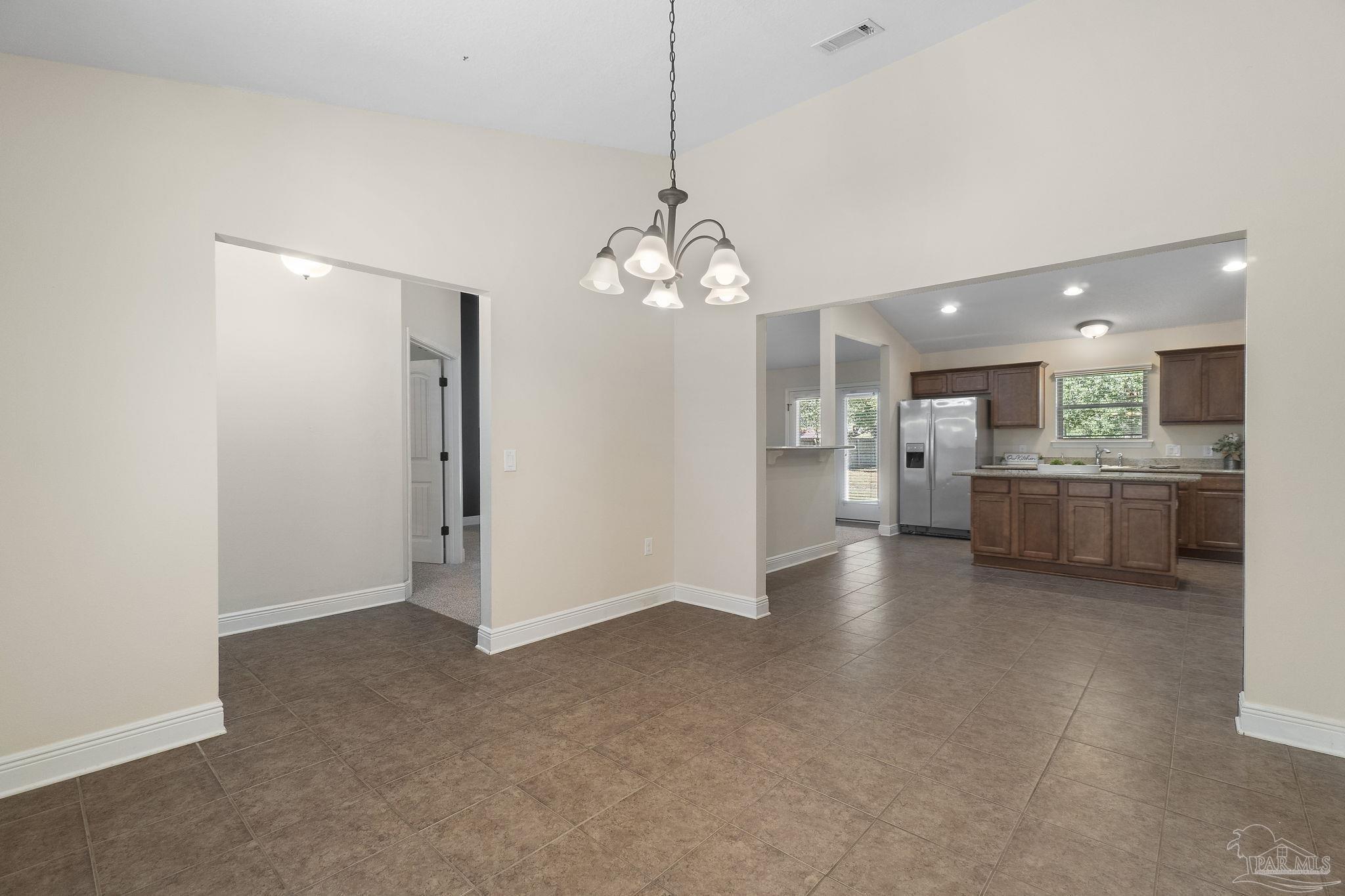 5607 Cane Syrup Circle Pace, FL 32571 - Photo 17 of 54 a view of a kitchen with a sink and a large window