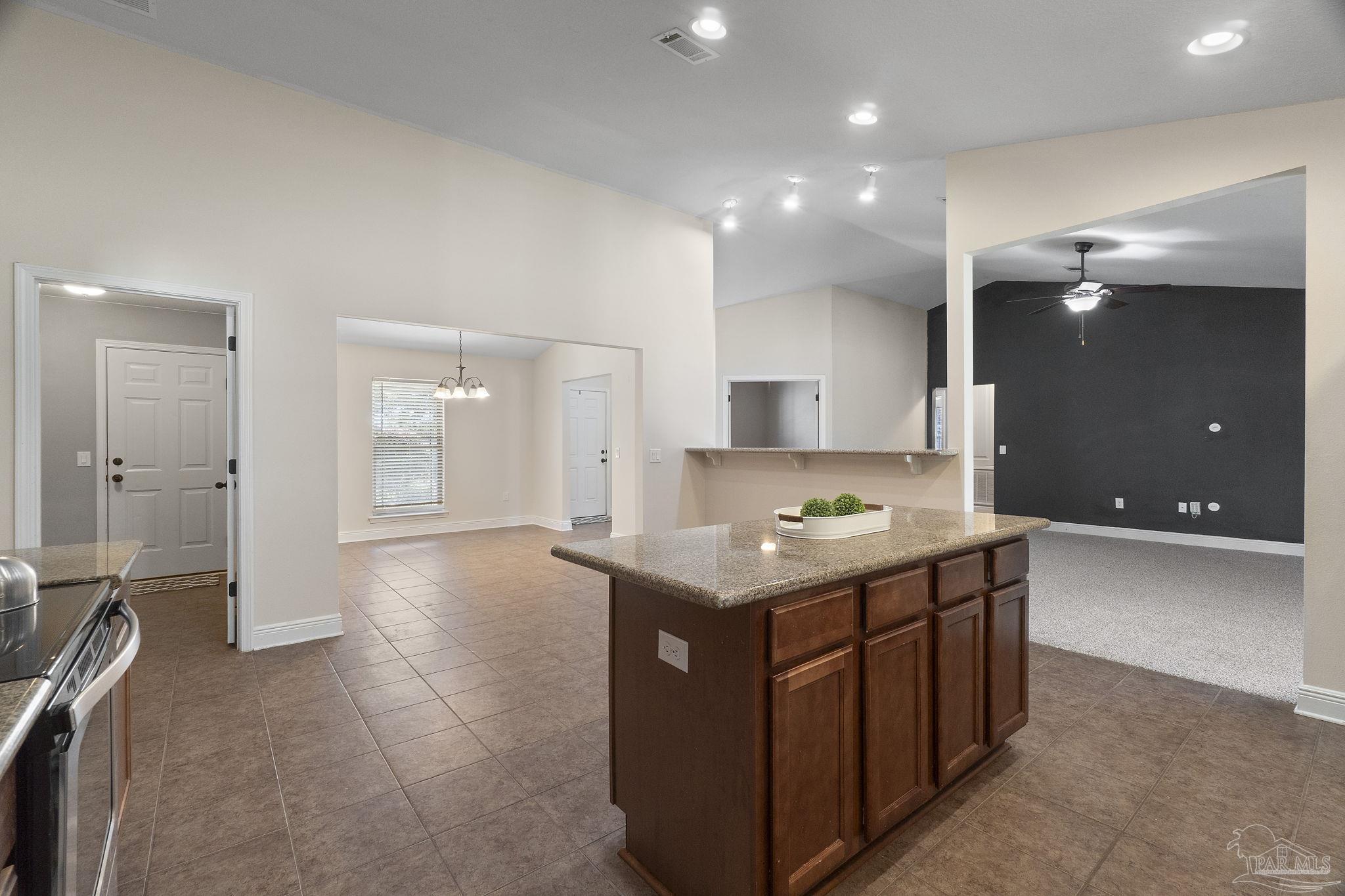 5607 Cane Syrup Circle Pace, FL 32571 - Photo 22 of 54 a kitchen with a stove and a sink