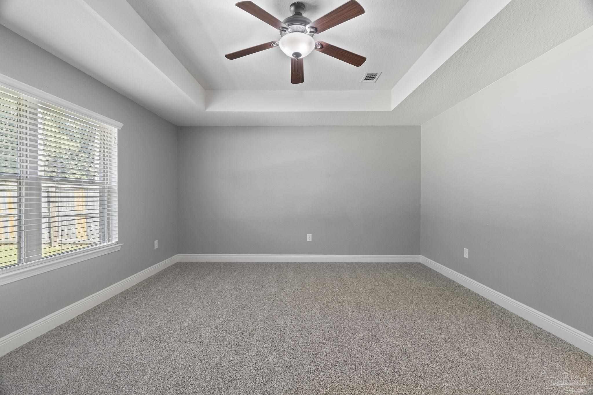 5607 Cane Syrup Circle Pace, FL 32571 - Photo 25 of 54 an empty room with a window and a fan