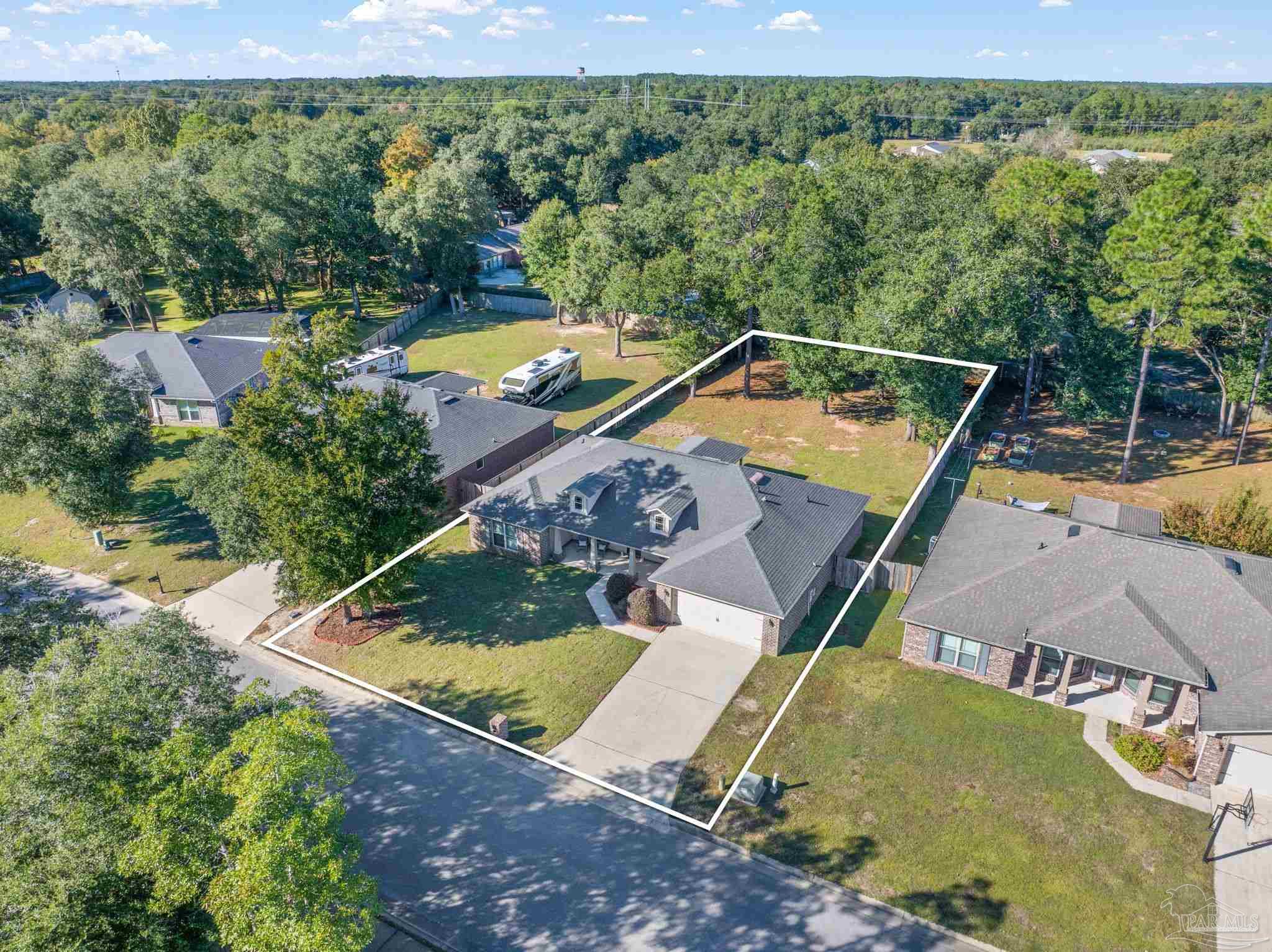 5607 Cane Syrup Circle Pace, FL 32571 - Photo 3 of 54 an aerial view of a house with a yard