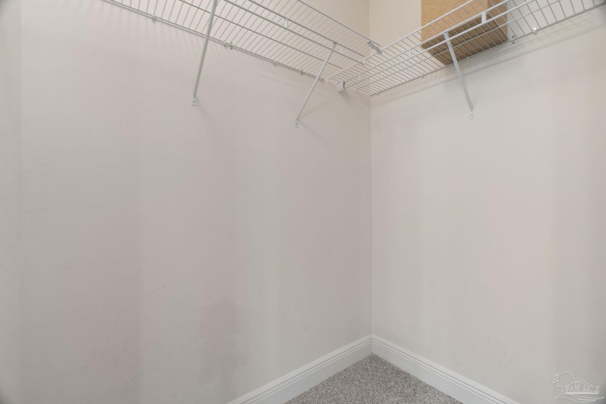 5607 Cane Syrup Circle Pace, FL 32571 - Photo 31 of 54 a view of a room with racks on the wall