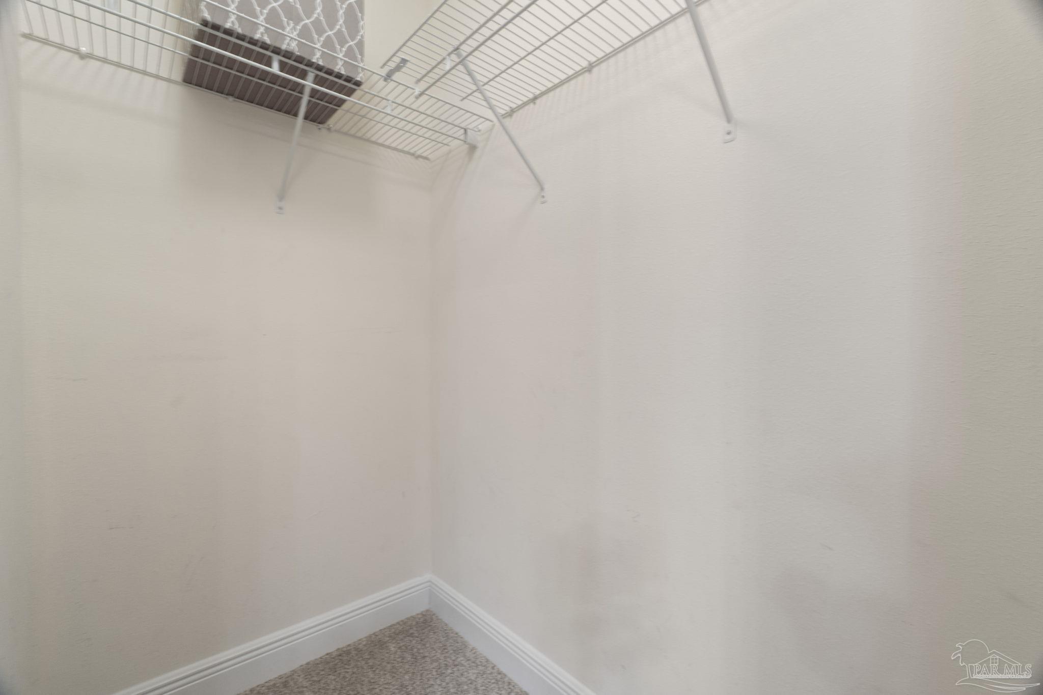 5607 Cane Syrup Circle Pace, FL 32571 - Photo 32 of 54 a view of a room with racks on the wall