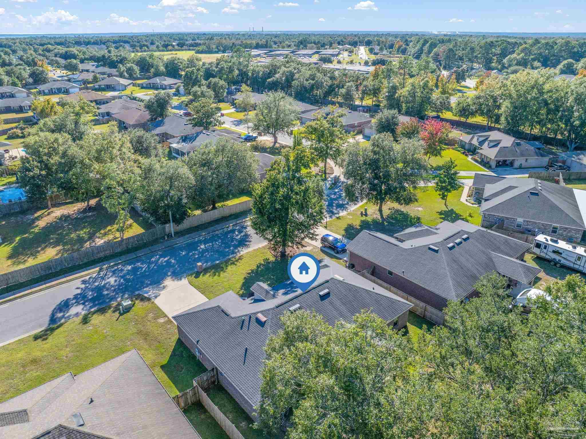 5607 Cane Syrup Circle Pace, FL 32571 - Photo 46 of 54 an aerial view of a house with a garden