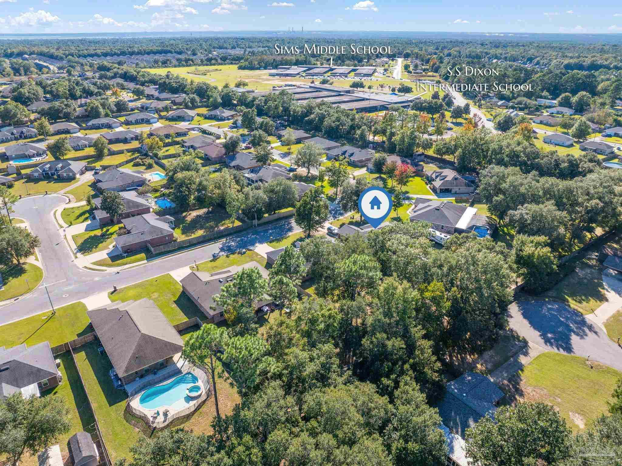 5607 Cane Syrup Circle Pace, FL 32571 - Photo 49 of 54 an aerial view of residential houses with outdoor space and swimming pool