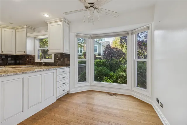 a room with a sink and cabinets
