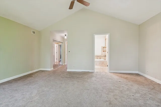 a bathroom with a tub sink shower and mirror