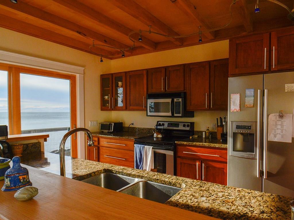 382 Red Point Road Swans Island, ME 04685 - Photo 9 of 35 Granite counter, cherry cabinets and...