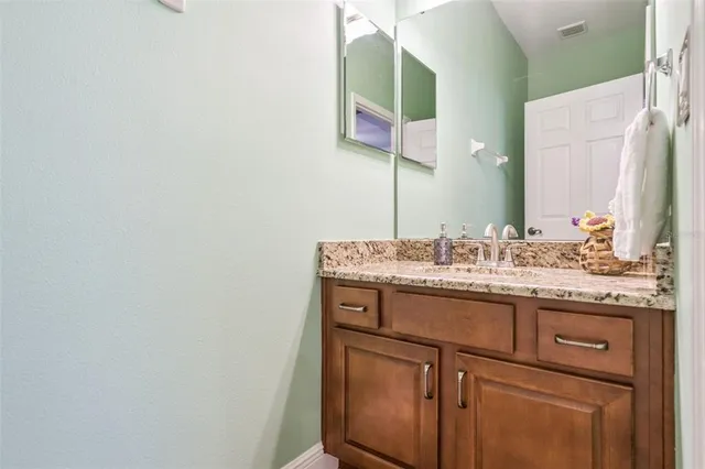 a bathroom with a shower and a glass door