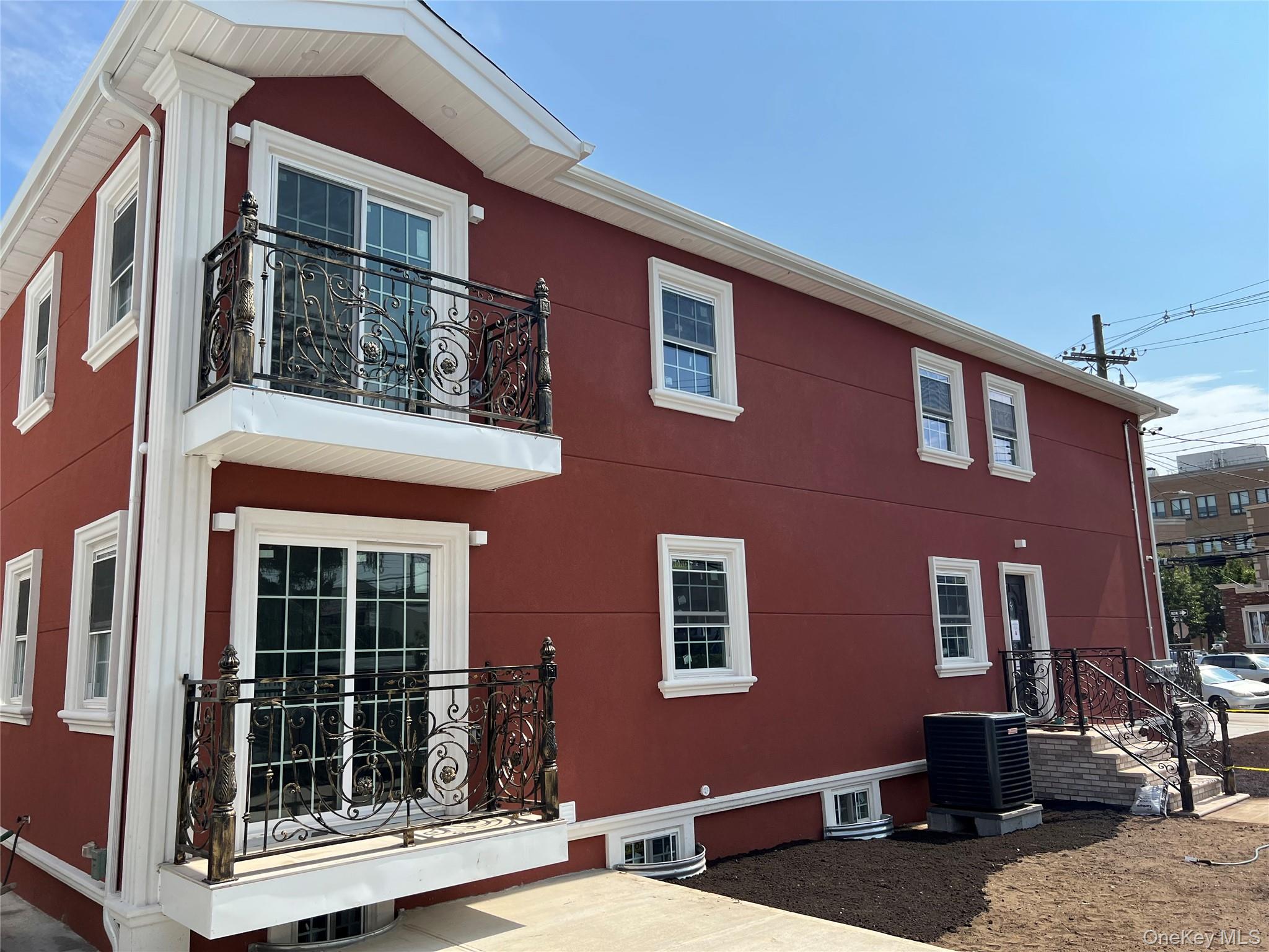 98-29 Albert Road Queens, NY 11417 - Photo 13 of 13 View of side of property with a balcony and a cooling unit