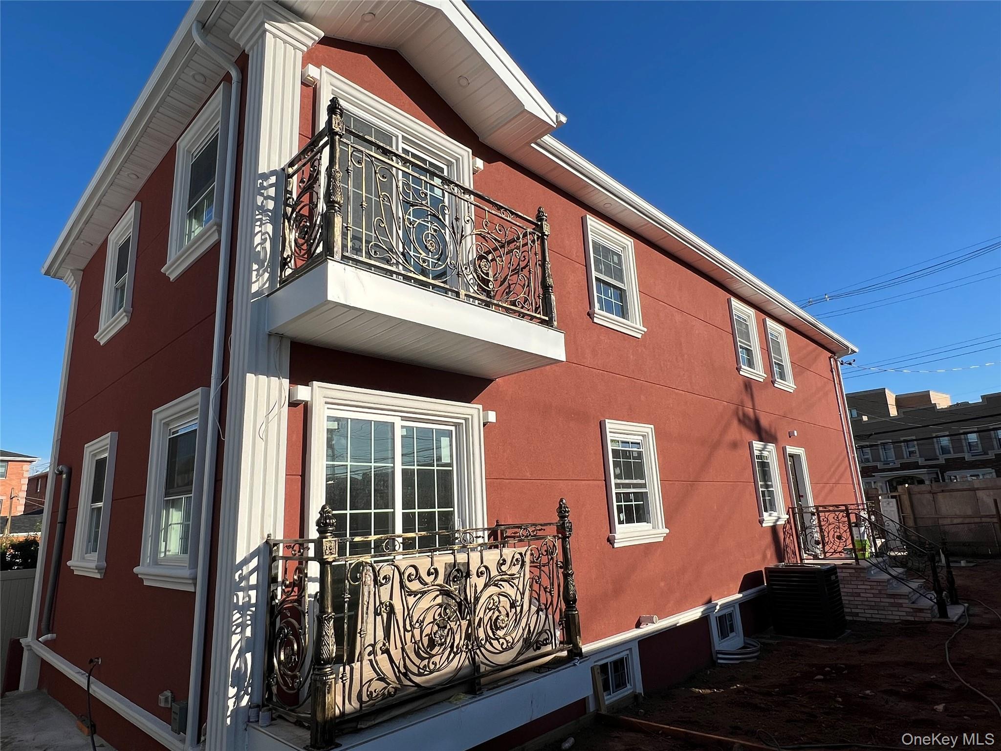 98-29 Albert Road Queens, NY 11417 - Photo 2 of 13 View of home's exterior featuring a balcony and a cooling unit