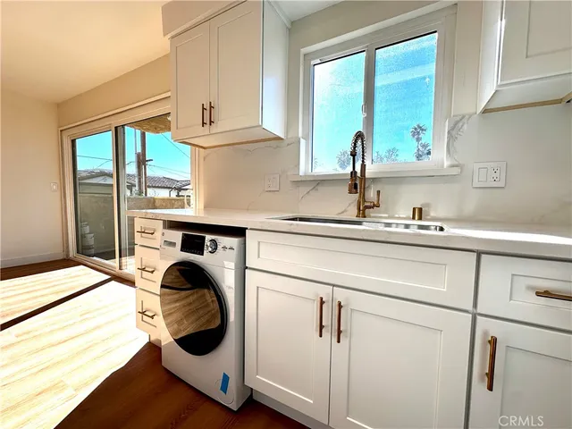 a kitchen with a sink and a window