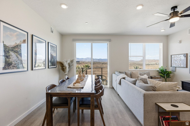 961 West Akoya Pearl Road, Unit 300 St. George, UT 84790 - Photo 17 of 60 Dining space featuring ceiling fan, light wood-style flooring, a textured ceiling, recessed lighting, and a mountain view