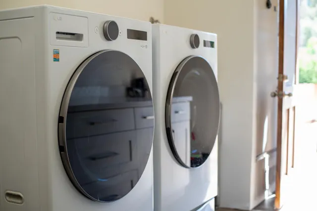 a close view of utility room with washer and dryer