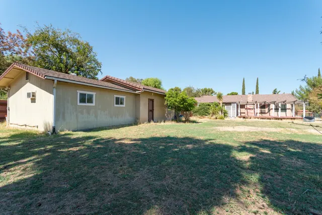 a utility room with dryer and trees
