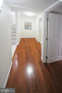 a bathroom with a sink toilet and mirror
