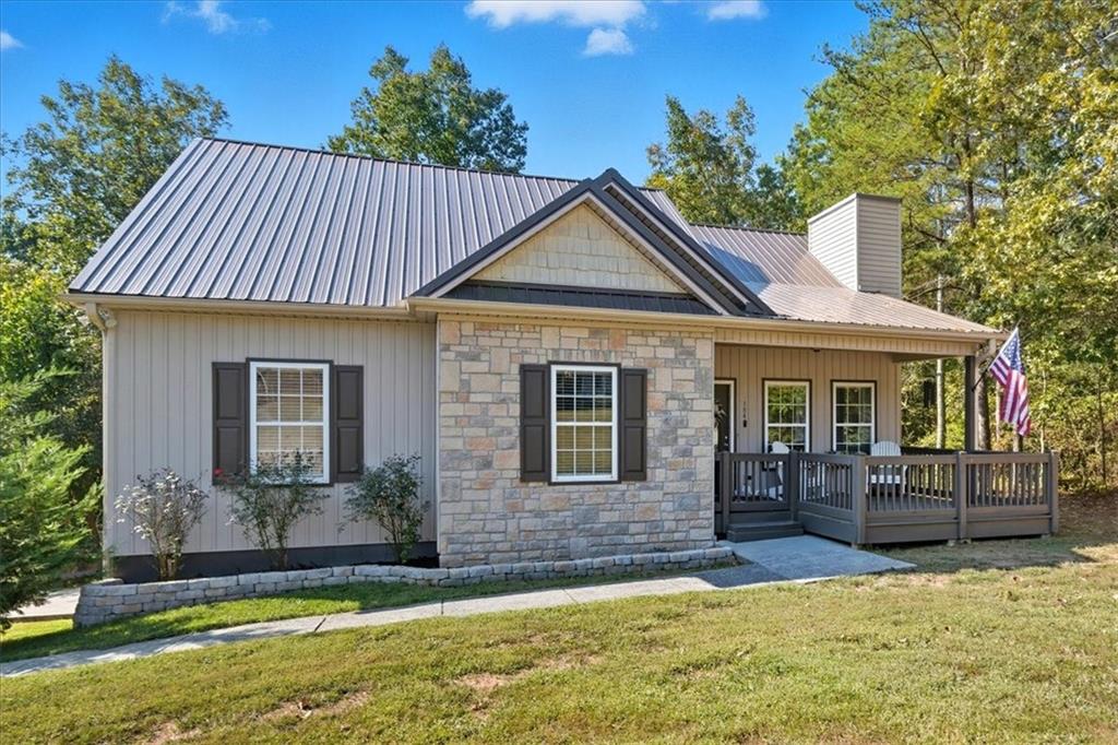 a front view of a house with a yard balcony