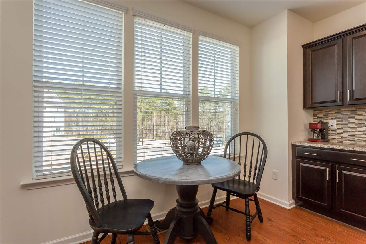 605 Edgewater Ridge Court Apex, NC 27523 - Photo 6 of 25 Bright breakfast nook is perfect for morning coffee while you catch up on your emails.