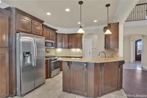 2805 Clearbrook Way Haughton, LA 71037 - Photo 11 of 33 a kitchen with kitchen island a sink stainless steel appliances and cabinets