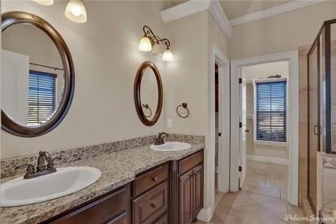 2805 Clearbrook Way Haughton, LA 71037 - Photo 16 of 33 a bathroom with a granite countertop double vanity sink and a mirror