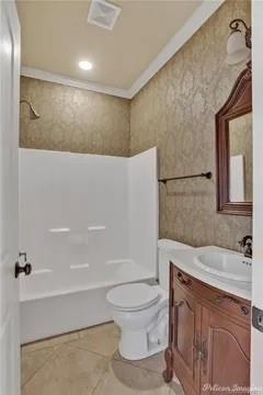 2805 Clearbrook Way Haughton, LA 71037 - Photo 21 of 33 a bathroom with a sink a toilet and a bathtub