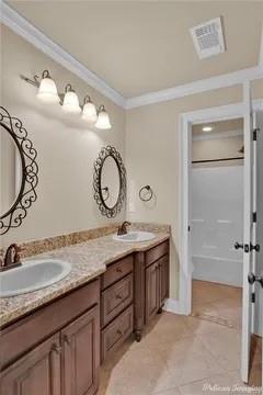 2805 Clearbrook Way Haughton, LA 71037 - Photo 24 of 33 a bathroom with a granite countertop sink a mirror and a vanity