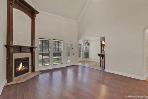 2805 Clearbrook Way Haughton, LA 71037 - Photo 7 of 33 a view of an empty room with wooden floor fireplace and a window