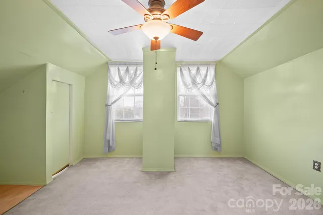 a view of a room with cabinet and a window