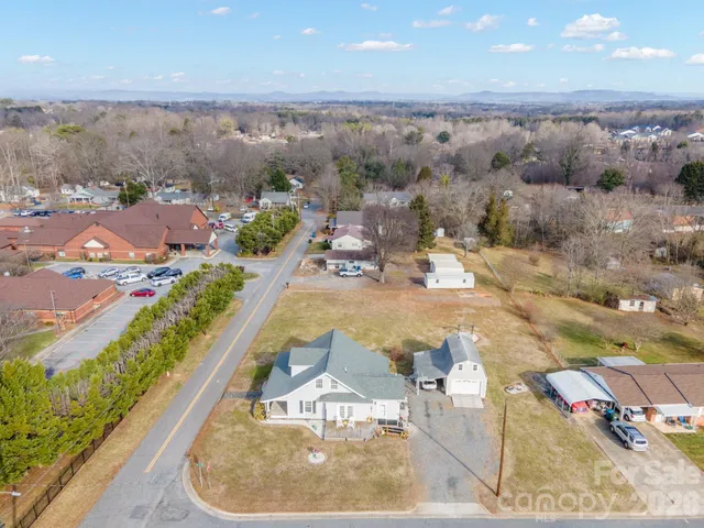 an aerial view of a house with a swimming pool