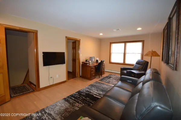 a room with furniture and air hockey table