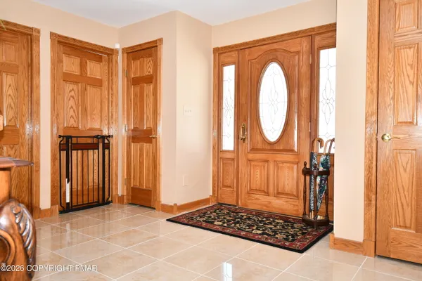 a view of entryway with wooden floor and stairs