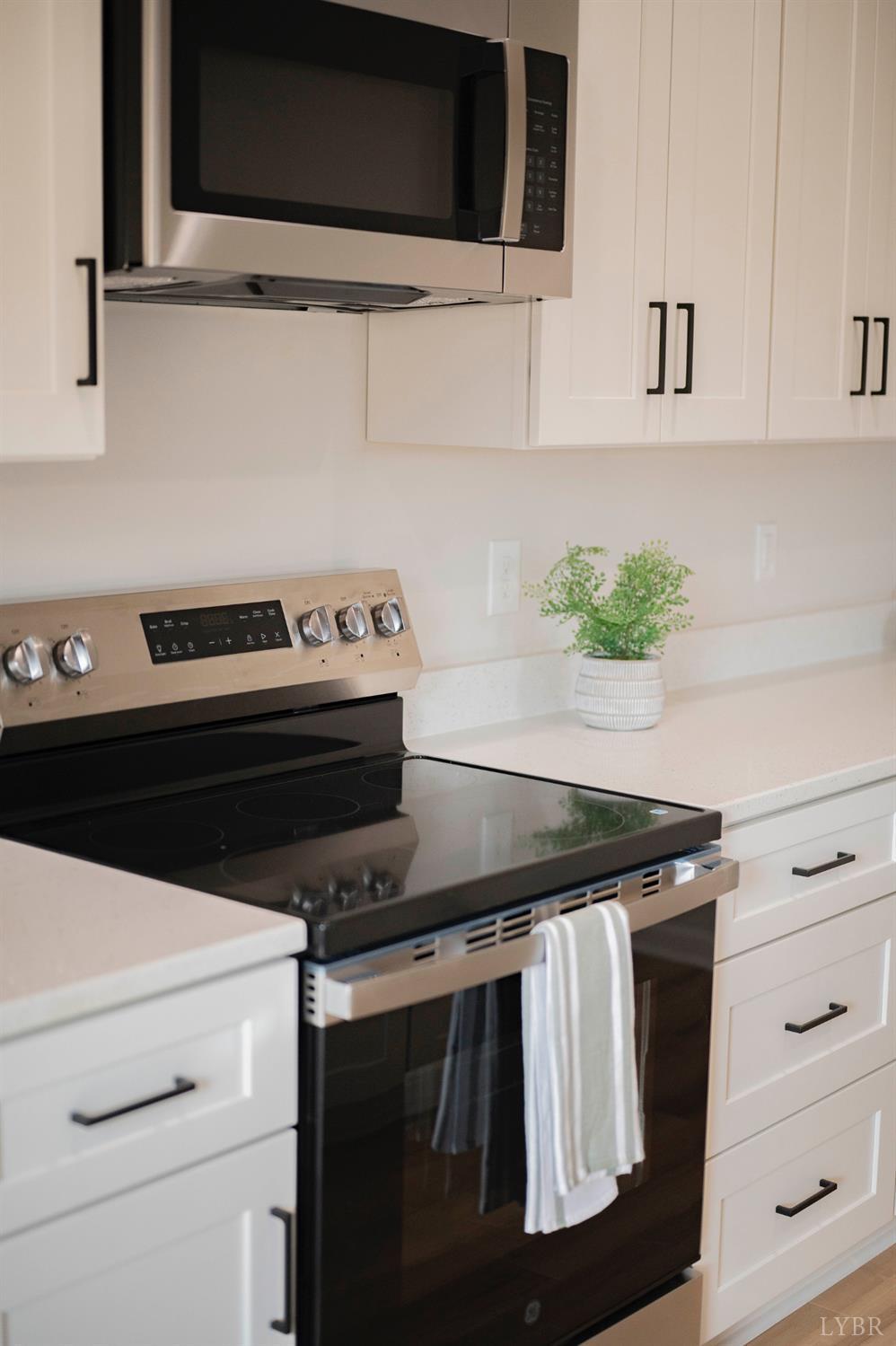 1833 Crockett Road Forest, VA 24551 - Photo 11 of 32 a stove top oven sitting inside of a kitchen