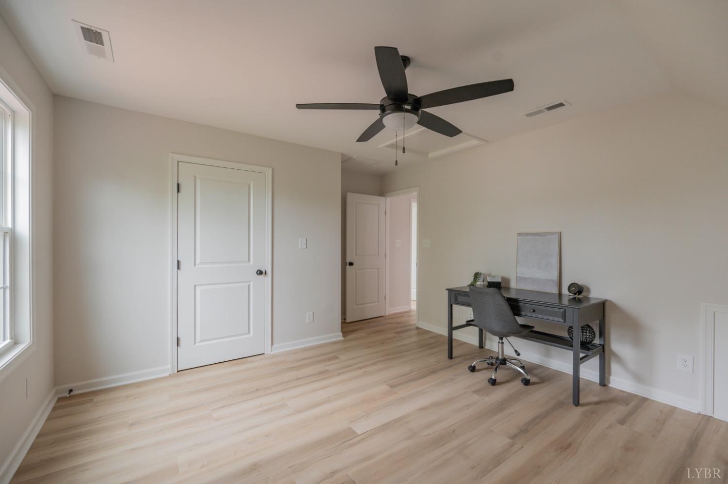 1833 Crockett Road Forest, VA 24551 - Photo 21 of 32 a view of a workspace with furniture and a window
