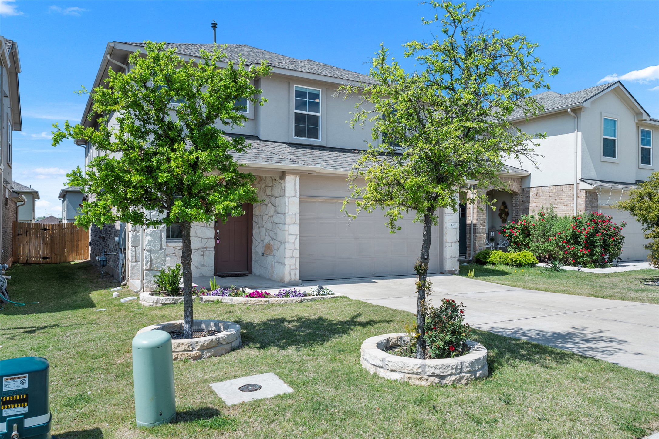 120 Ellinger Road Georgetown, TX 78626 - Photo 12 of 28 Stucco and stone facade with a two-car garage