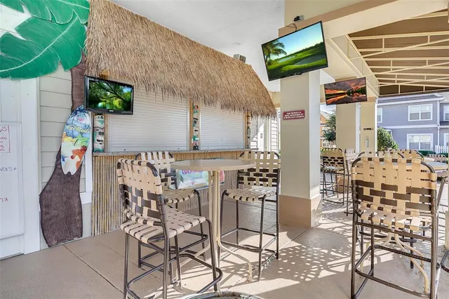 a terrace of a house with table and chairs