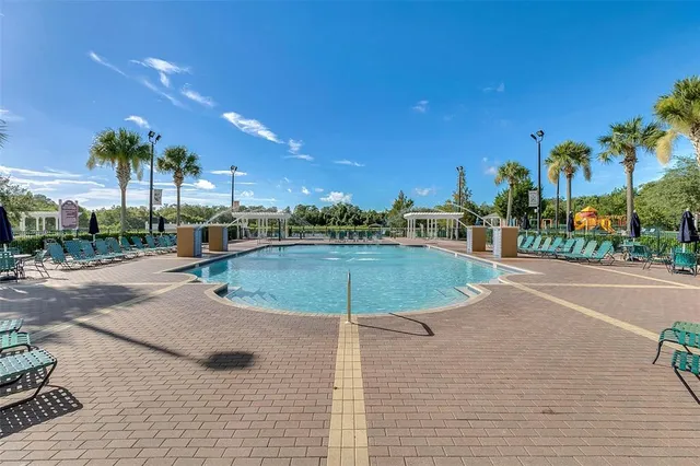 a view of a swimming pool with a yard