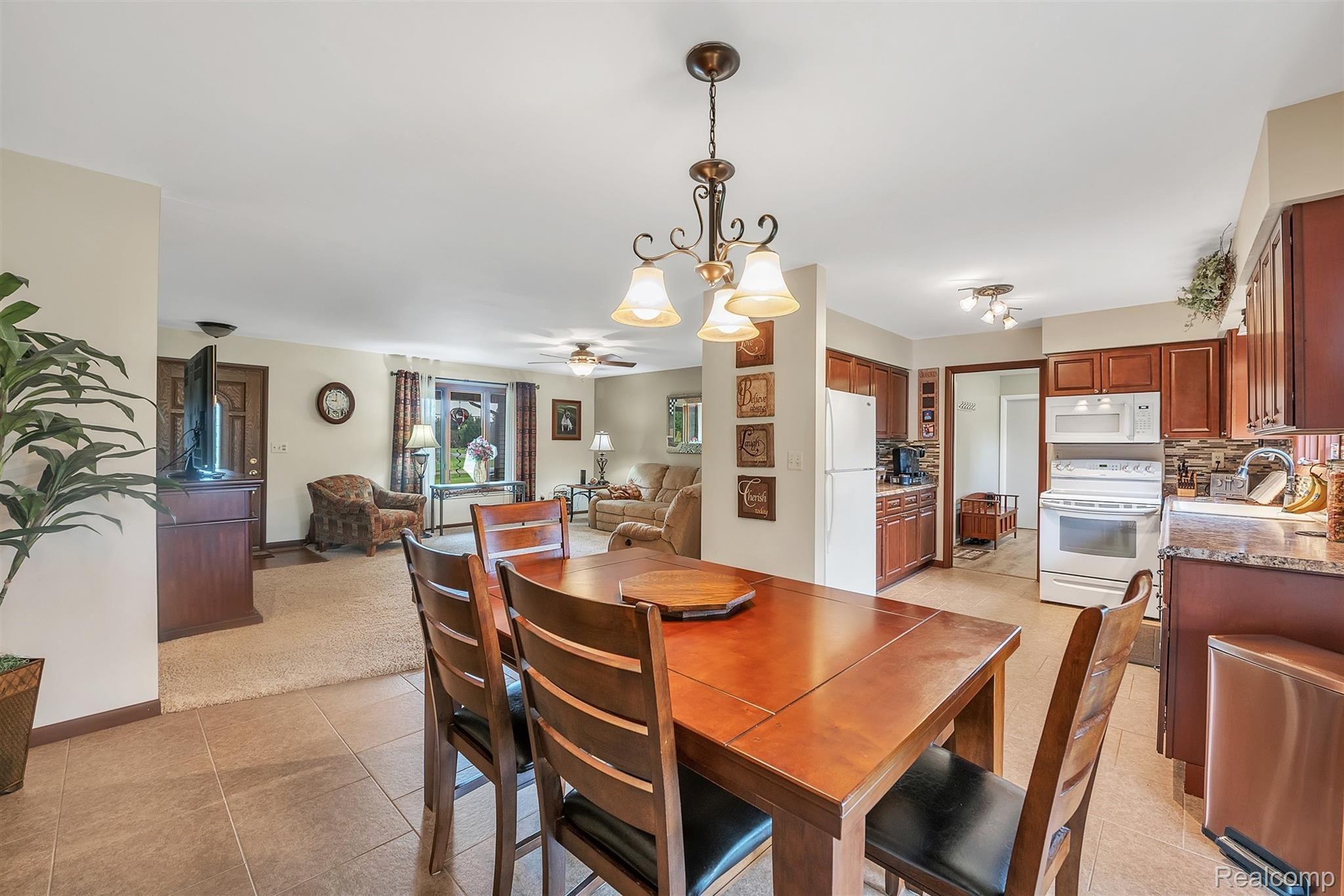 3876 Innisfree Road Howell, MI 48855 - Photo 5 of 31 Oversize 16x16 Ceramic Tile in Dining Area & Kitchen