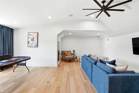 a view of a house with backyard porch and sitting area