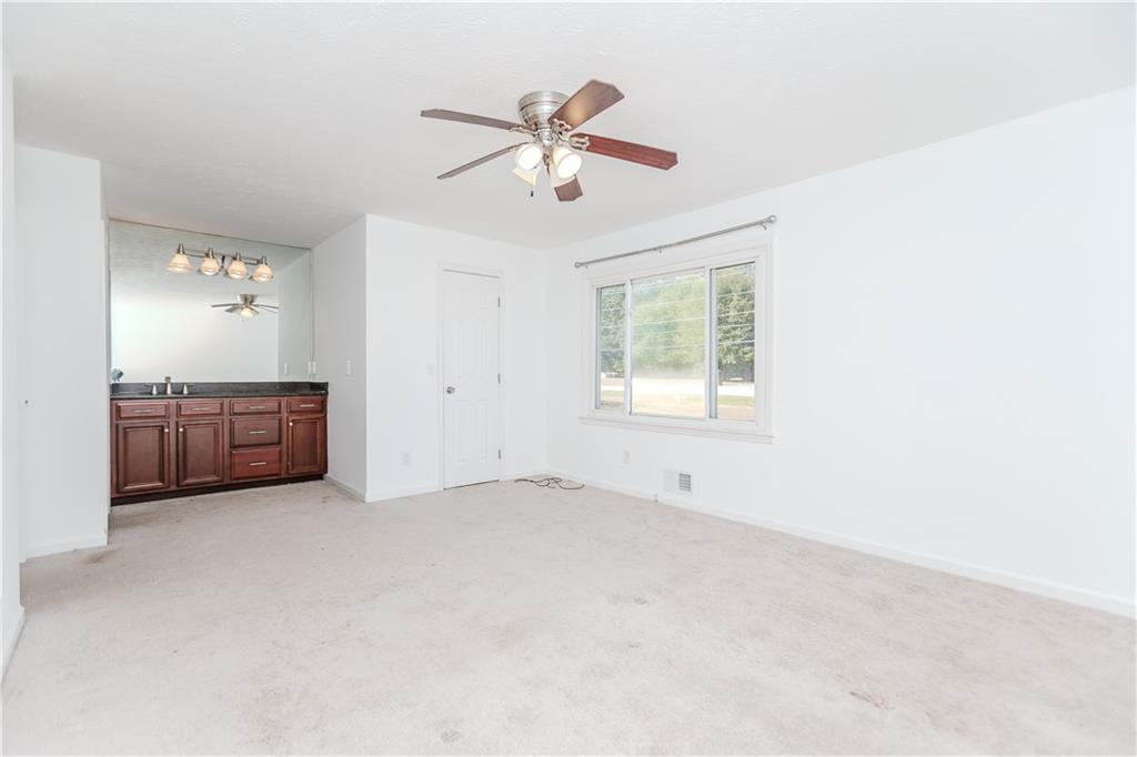 3408 Hamilton Mill Road Buford, GA 30519 - Photo 13 of 32 a view of an empty room with cabinet and a window