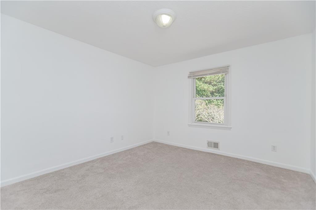 3408 Hamilton Mill Road Buford, GA 30519 - Photo 19 of 32 an empty room with a window