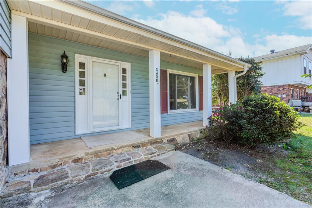 3408 Hamilton Mill Road Buford, GA 30519 - Photo 2 of 32 a front view of a house with garden