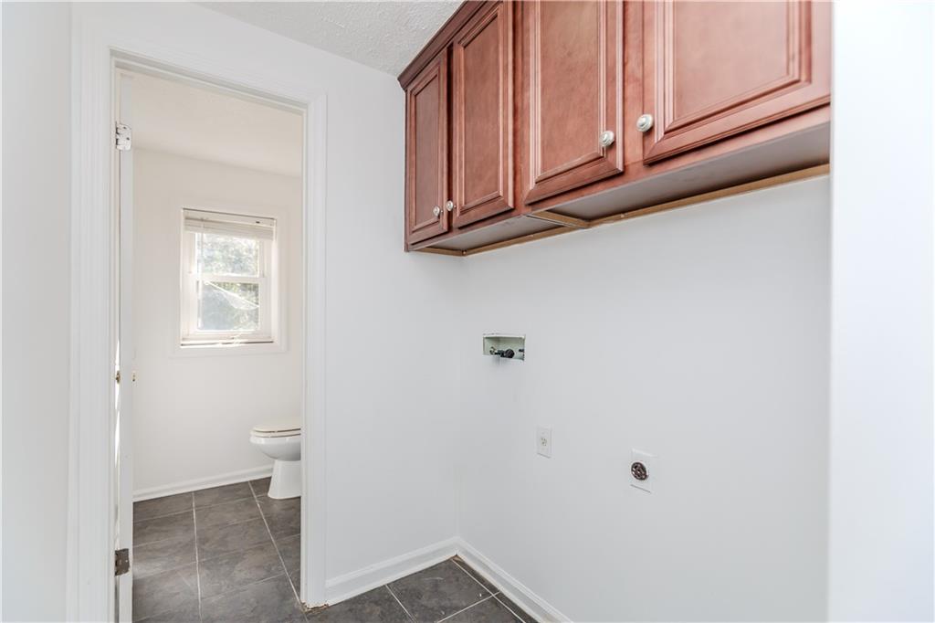 3408 Hamilton Mill Road Buford, GA 30519 - Photo 25 of 32 a view of a storage and utility room with cabinet