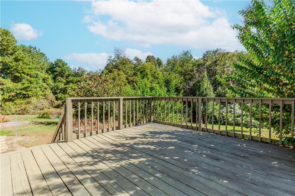 3408 Hamilton Mill Road Buford, GA 30519 - Photo 27 of 32 a balcony with wooden floor and fence