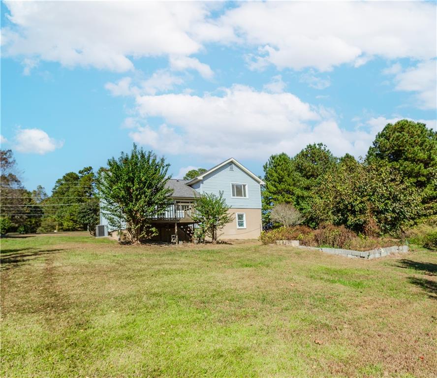 3408 Hamilton Mill Road Buford, GA 30519 - Photo 31 of 32 a view of a house with a yard and potted plants