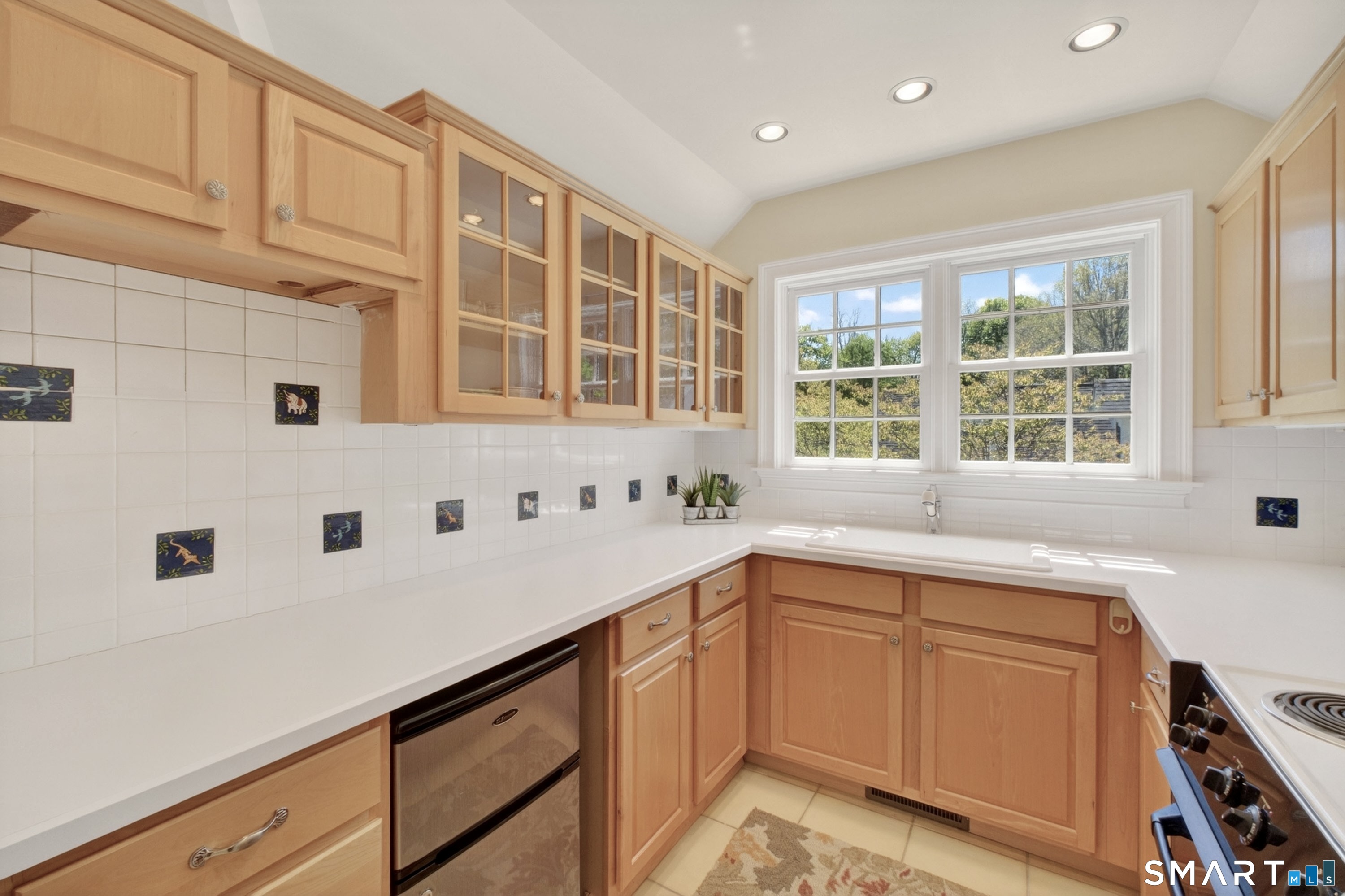 41 Peaceable Street Ridgefield, CT 06877 - Photo 31 of 40 a kitchen with a sink and large window