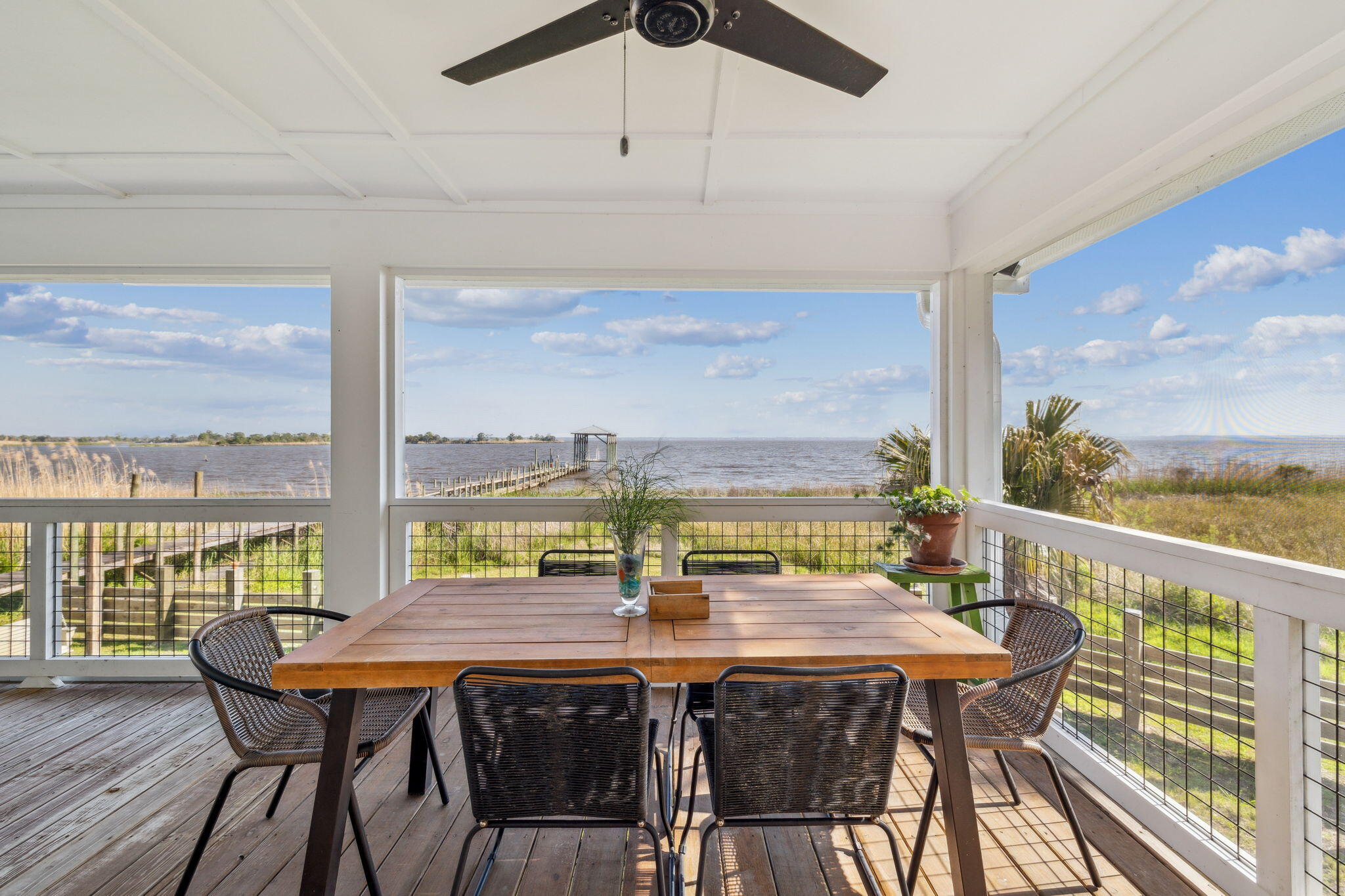 227 Shady Lane Freeport, FL 32439 - Photo 12 of 32 a view of a dining room with furniture window and outside view