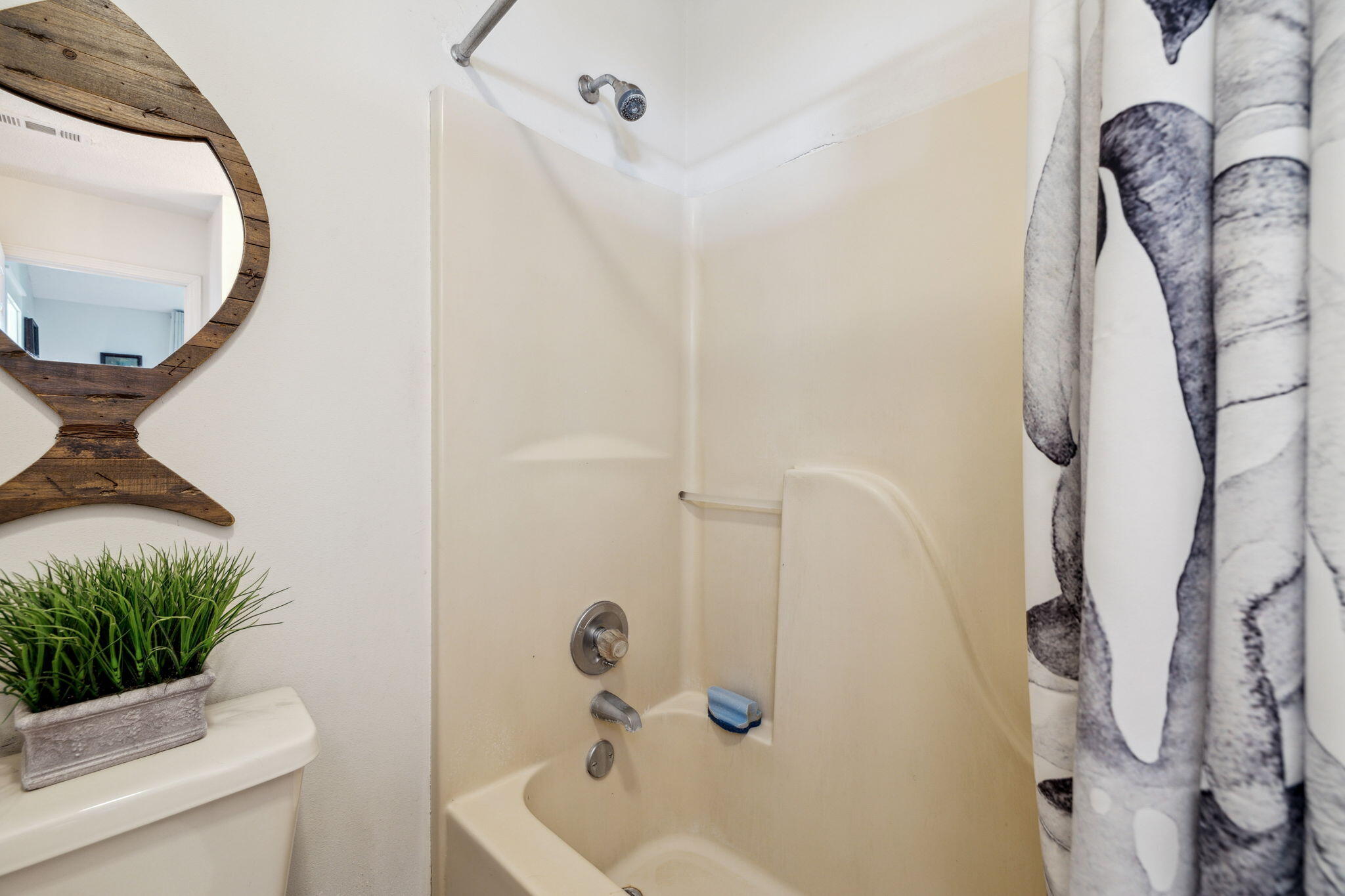 227 Shady Lane Freeport, FL 32439 - Photo 18 of 32 a bathroom with a sink a toilet and a mirror