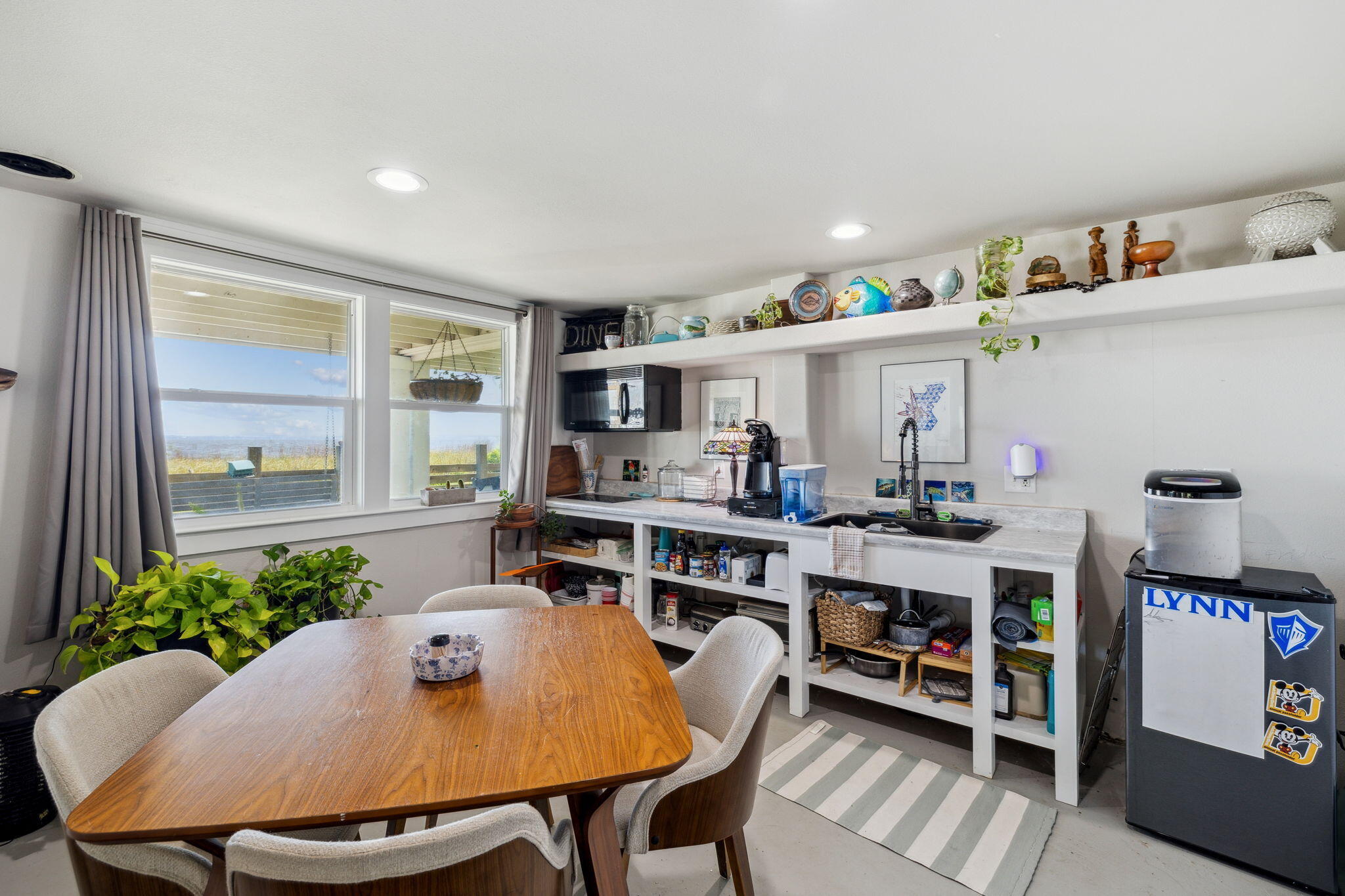 227 Shady Lane Freeport, FL 32439 - Photo 24 of 32 a view of a dining room with furniture and a potted plant