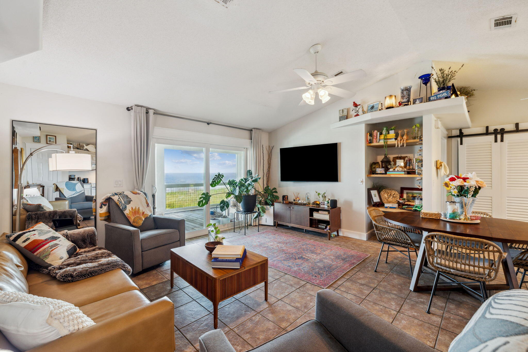 227 Shady Lane Freeport, FL 32439 - Photo 4 of 32 a living room with furniture a flat screen tv and a table