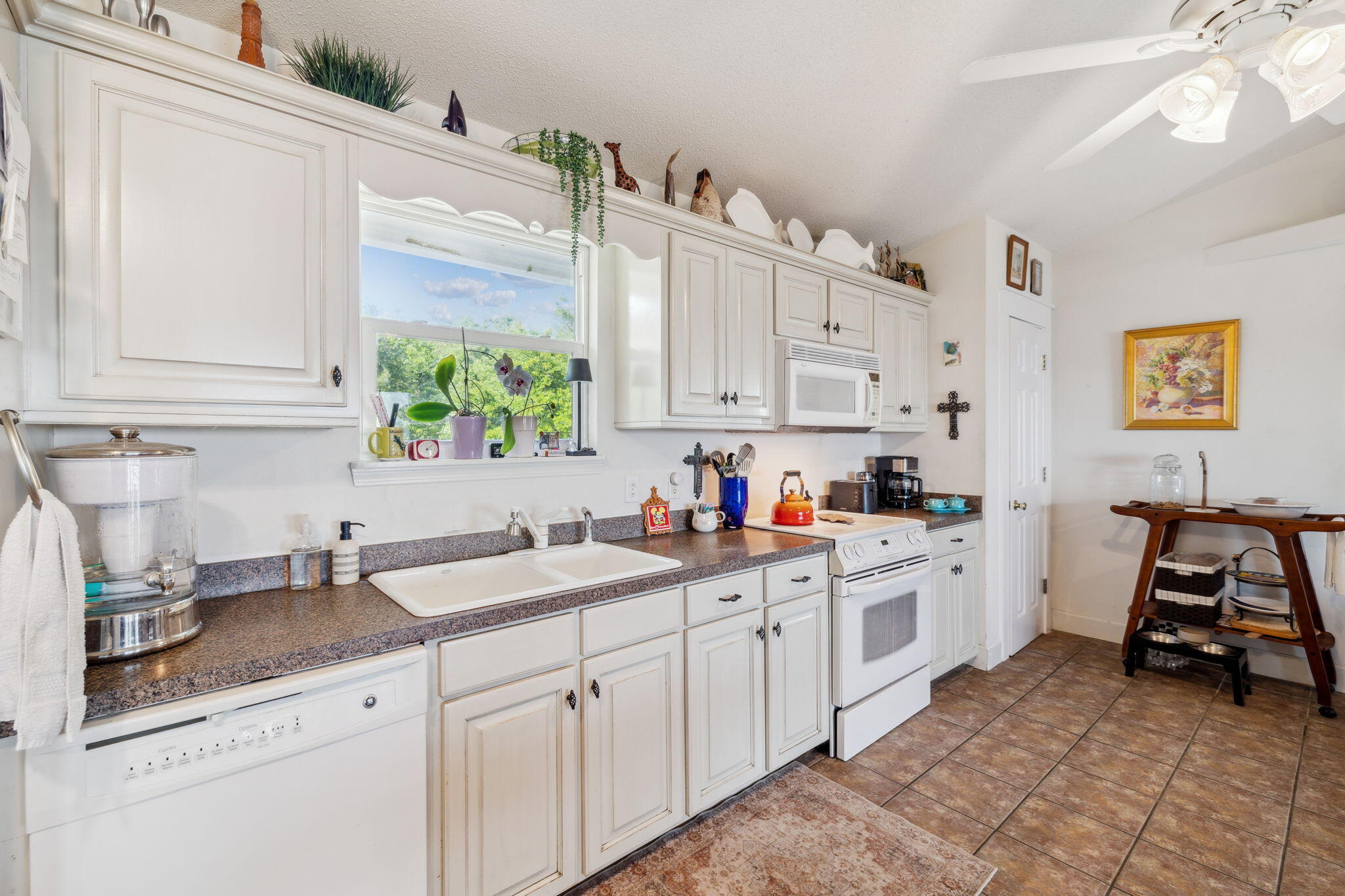 227 Shady Lane Freeport, FL 32439 - Photo 7 of 32 a kitchen filled with white cabinets and sink