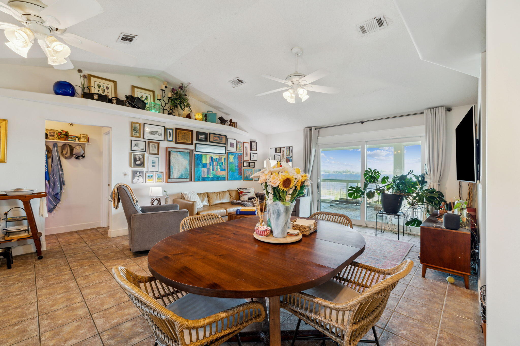 227 Shady Lane Freeport, FL 32439 - Photo 9 of 32 a dining room with furniture a rug and wooden floor